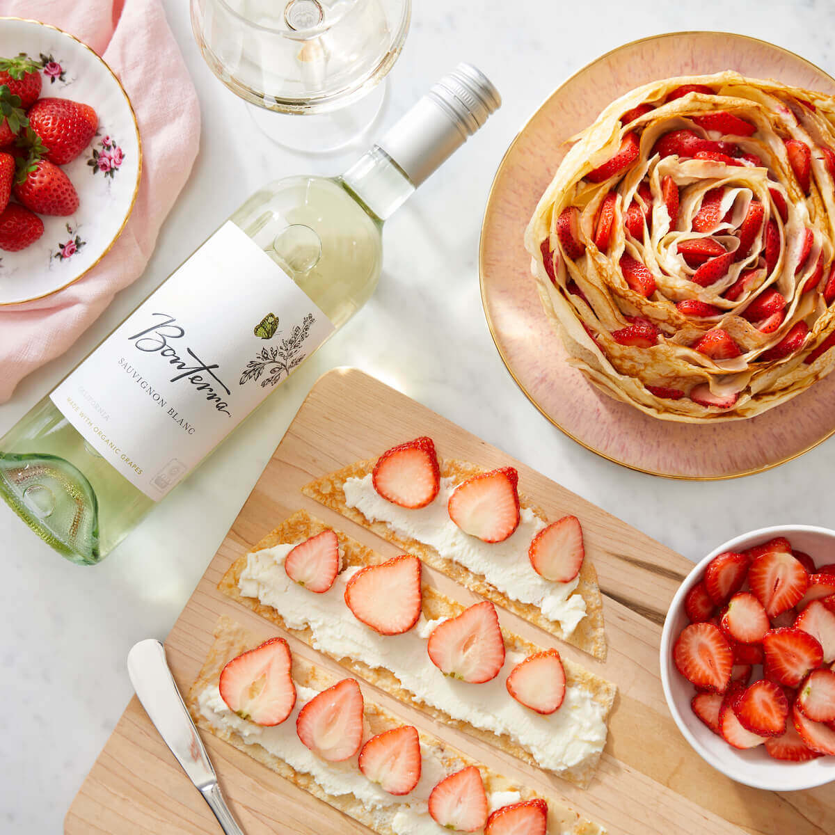 Strawberry Crepe Cake with Sauv Blanc bottle of wine