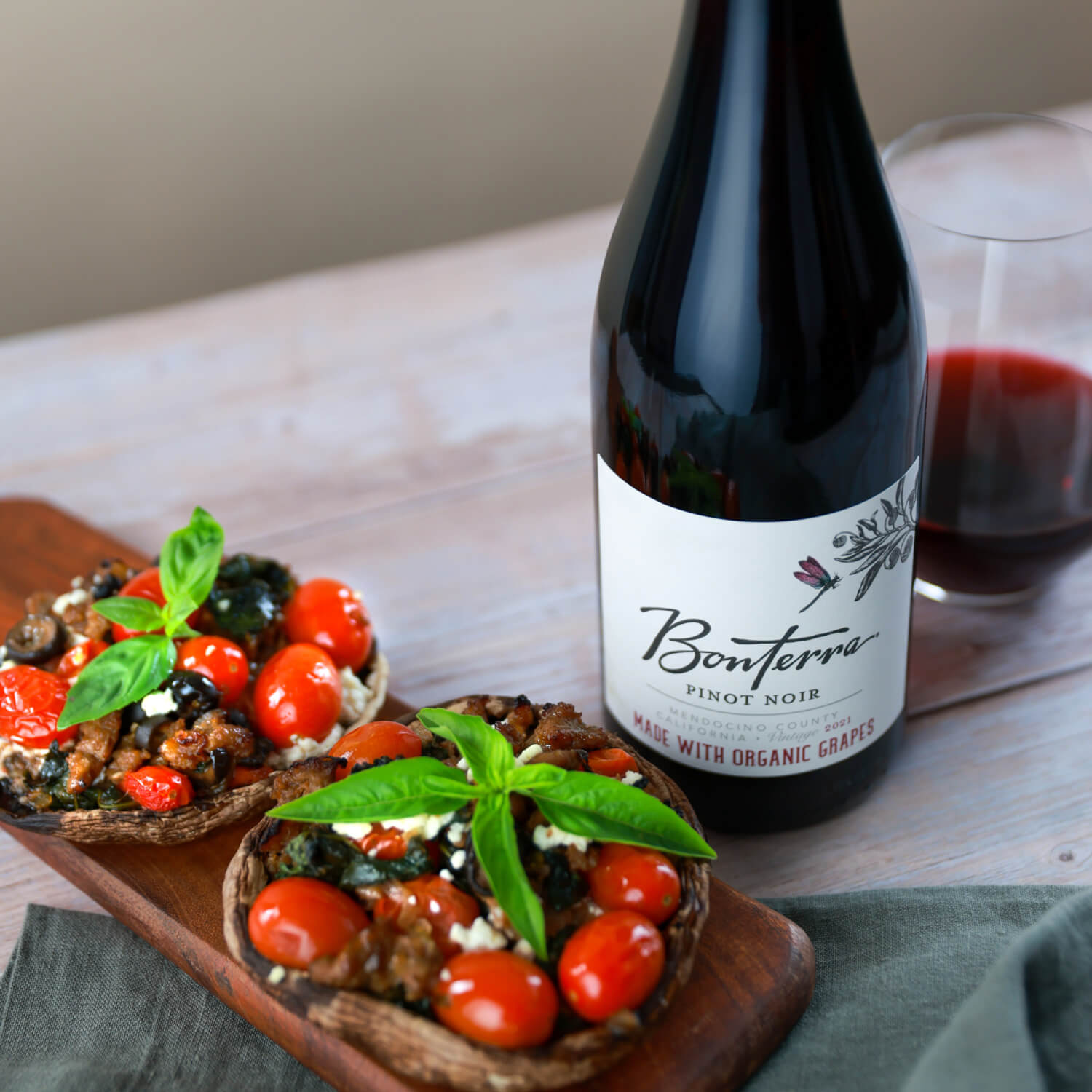 Bonterra Pinot Noir with Portobello pizzas dish on the side.