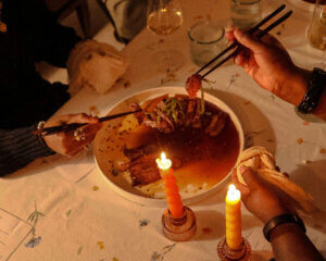 Steak Tataki recipe enjoyed by a group of people by candlelight